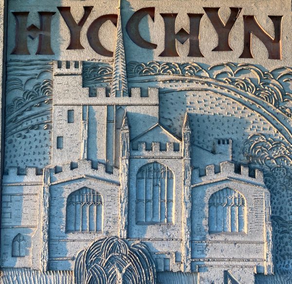 Carved stone depicting St.Mary's church in Hitchin and typography showing the historic spelling of the town; Hycchyn